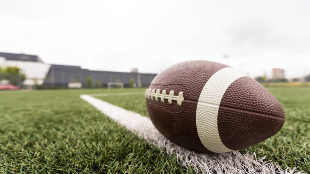 American Football with the Fifty Yard Line Beyond. High quality photo